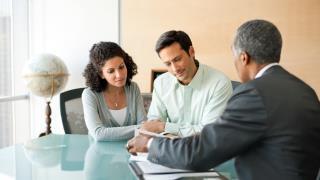 Wells Fargo Advisors Financial Advisor consulting with clients